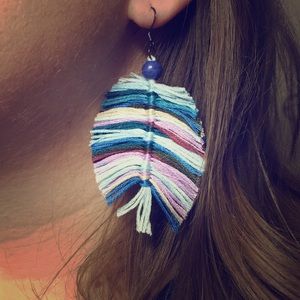 Feather accent earrings.